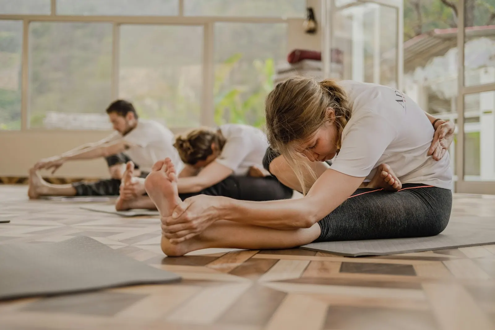 A yoga class in a bright studio